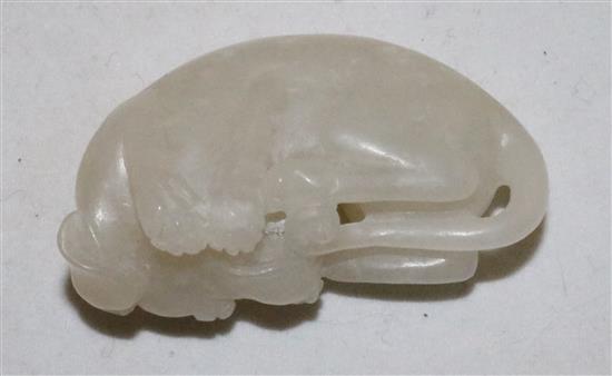 A Chinese white jade figure of a recumbent hound, 20th century, 5cm